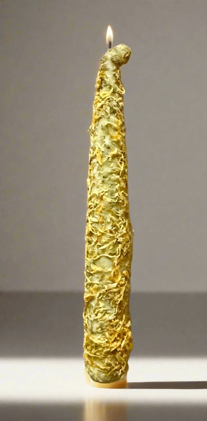 Golden Marigold Protection Ritual Candle, 8-inch soy taper candle, lit with a unique textured design for spiritual rituals.